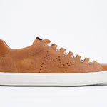 Side profile of low top sneaker with perforated crown logo on upper. Full rust suede upper and white rubber sole.
