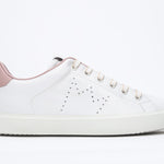 Side profile of low top white sneaker with pale pink detailing and perforated crown logo on upper. Full leather upper and white rubber sole.