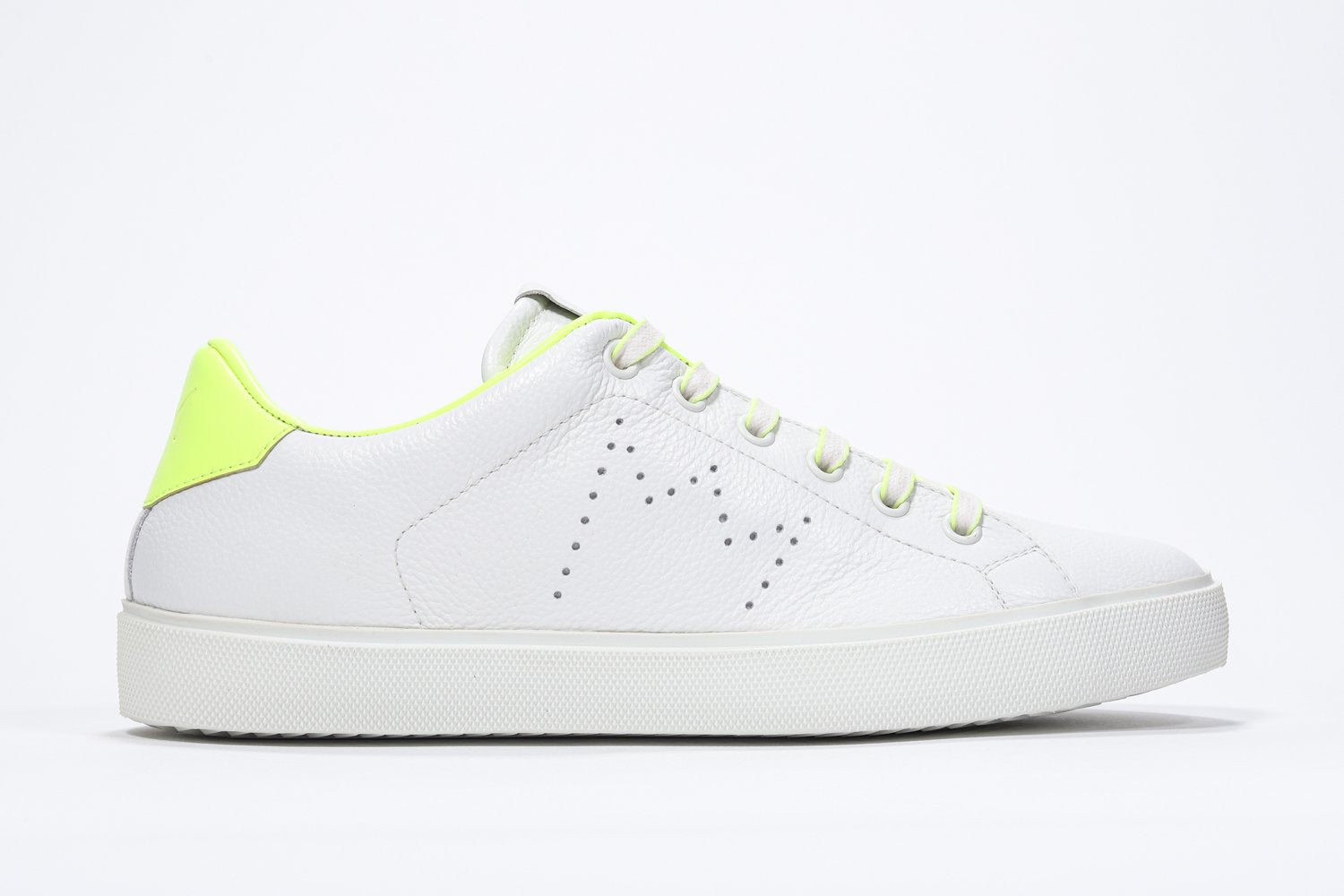 Side profile of low top white sneaker with neon yellow detailing and perforated crown logo on upper. Full leather upper and white rubber sole.