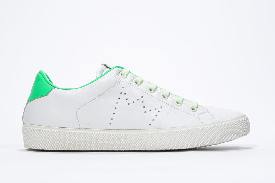 Side profile view of low top white sneaker with neon green detailing and perforated crown logo on upper. Full leather upper and white rubber sole.