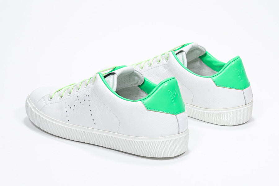 Three quarter back view of low top white sneaker with neon green detailing and perforated crown logo on upper. Full leather upper and white rubber sole.