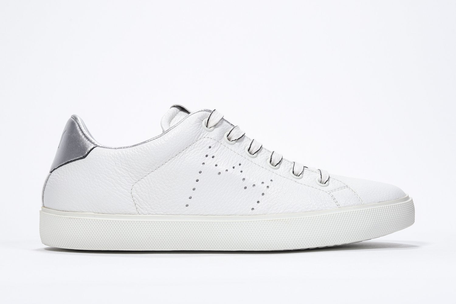 Side profile of low top white sneaker with silver detailing and perforated crown logo on upper. Full leather upper and white rubber sole.