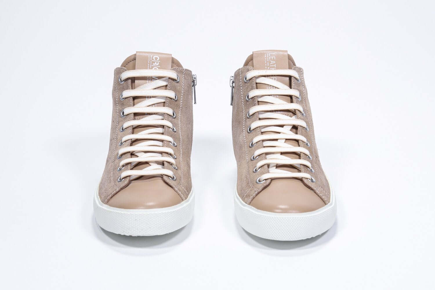 Front view of mid top cuoio sneaker with full suede upper with perforated crown logo, internal zip and white sole.