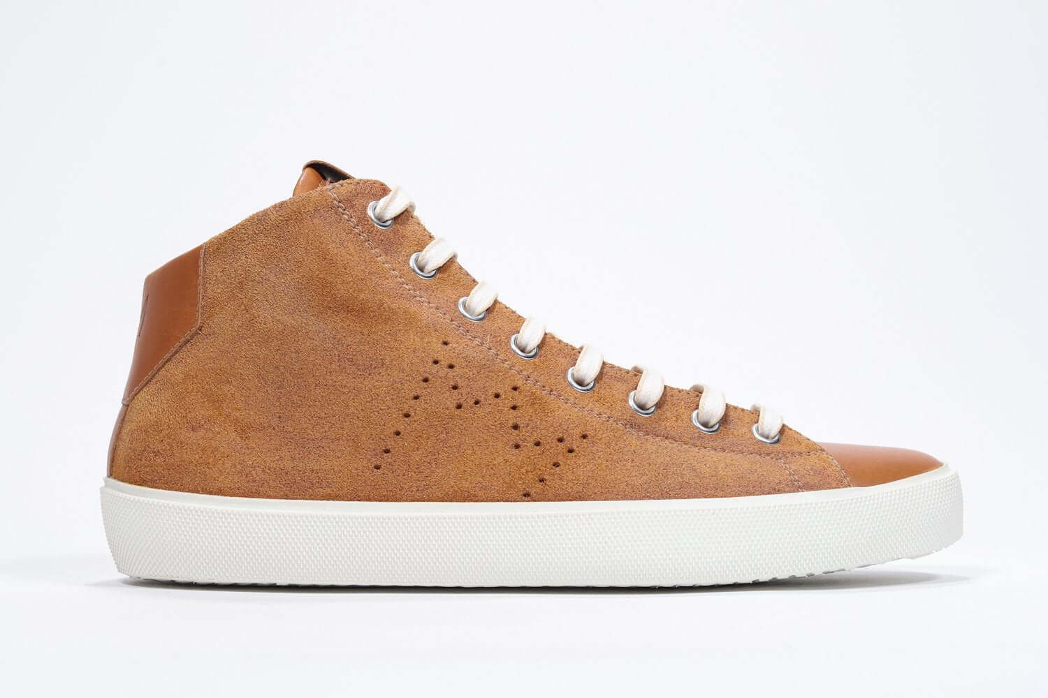 Side profile of mid top rust sneaker with full suede upper with perforated crown logo, internal zip and white sole.