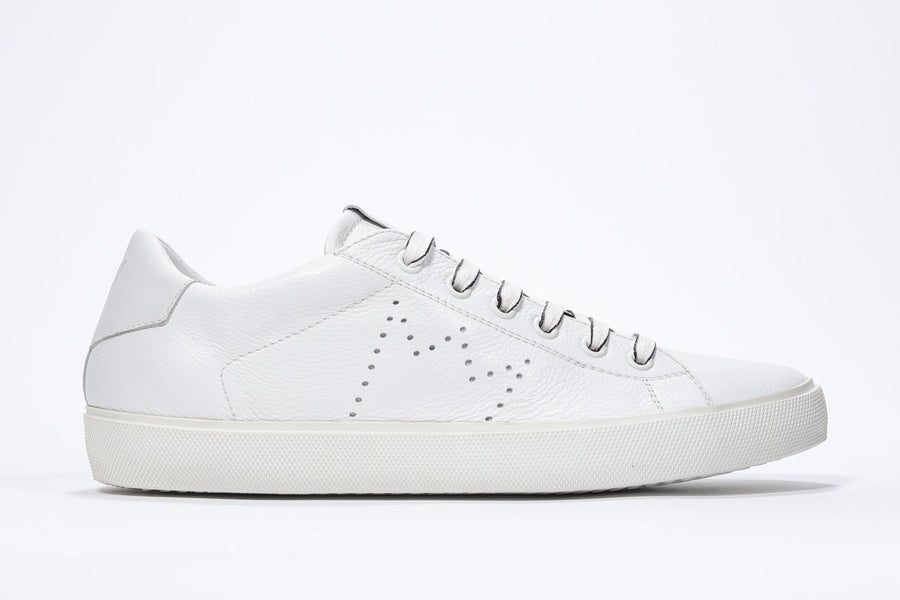 Side profile of low top white sneaker with perforated crown logo on upper. Full leather upper and white rubber sole.