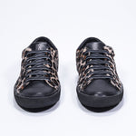 Front view of low top leopard print sneaker. Full haircalf leather upper and black rubber sole.