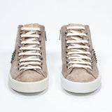 Front view of mid top cuoio color sneaker. Full suede upper with studs, an internal zip and vintage rubber sole.
